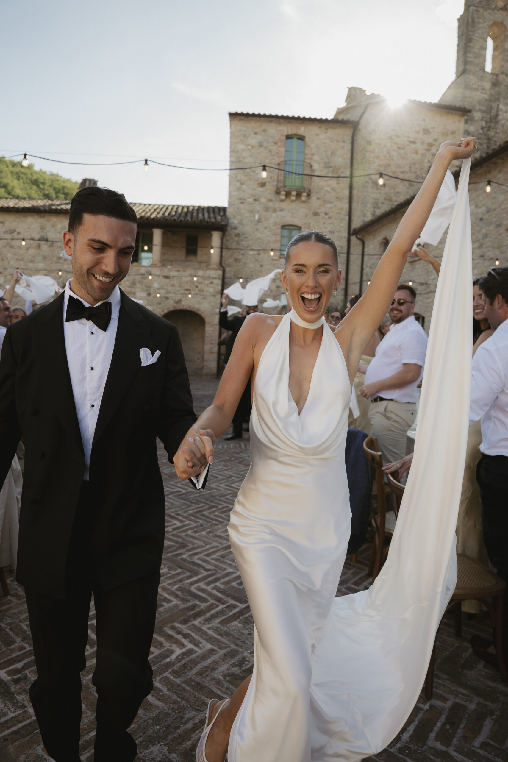 Couple sharing a first dance at a Tuscany villa wedding, documentary style